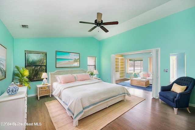 bedroom with dark wood-type flooring, ceiling fan, and lofted ceiling