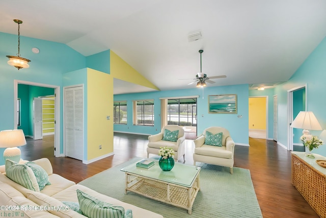 living room featuring ceiling fan, dark hardwood / wood-style flooring, and vaulted ceiling