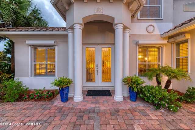 entrance to property featuring french doors