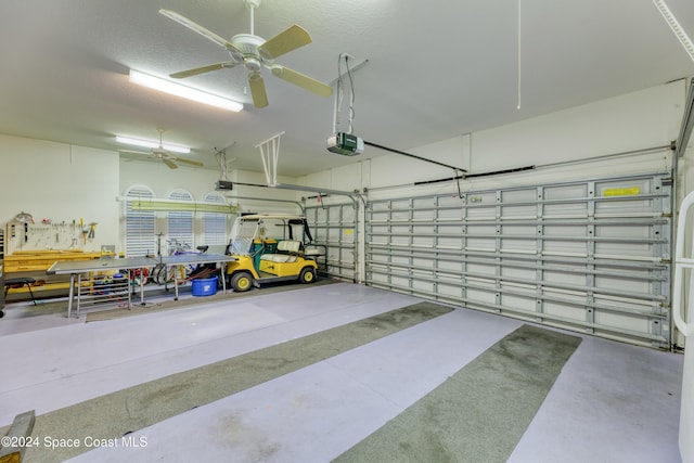 garage featuring ceiling fan and a garage door opener