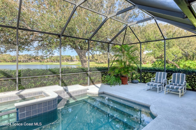 view of pool featuring glass enclosure, a water view, an in ground hot tub, central AC, and a patio