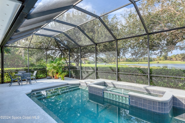 view of swimming pool with a water view, a lanai, a patio, and an in ground hot tub