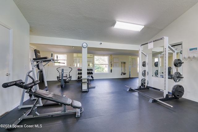 exercise room featuring a textured ceiling