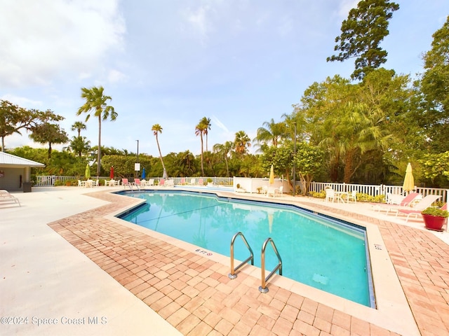 view of pool featuring a patio