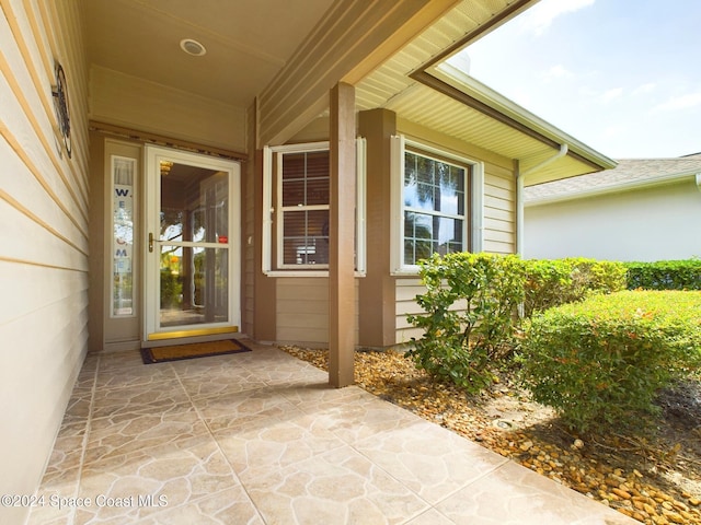 entrance to property with a patio