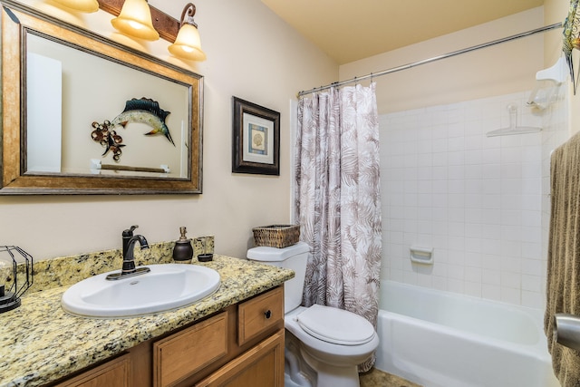 full bathroom with vanity, shower / bath combo with shower curtain, and toilet