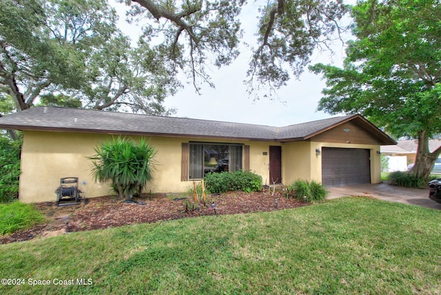 single story home featuring a garage and a front yard