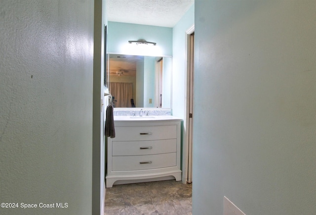 bathroom featuring vanity and a textured ceiling