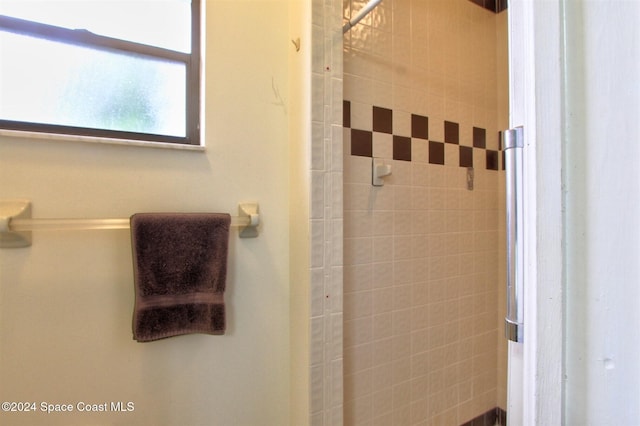 bathroom with a tile shower