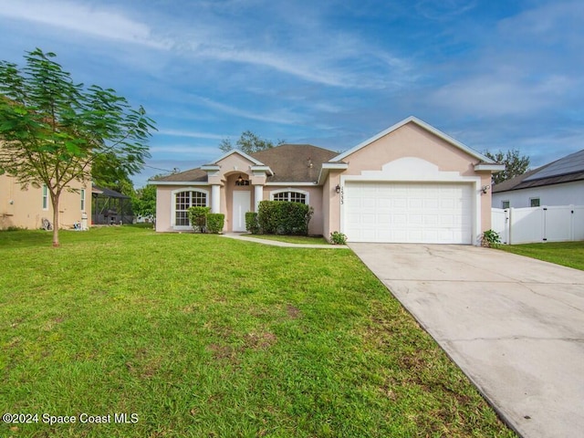 single story home with a front lawn and a garage