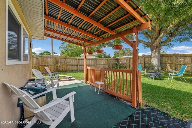 view of patio with an outdoor fire pit