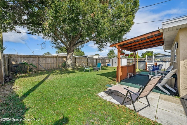 view of yard featuring a patio and a storage unit