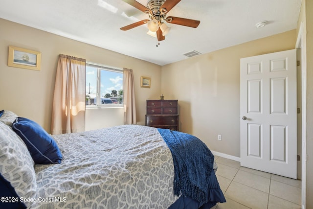 bedroom with light tile patterned flooring and ceiling fan