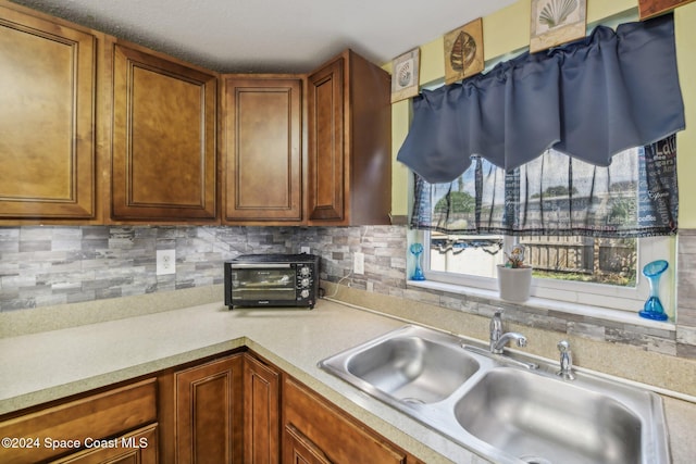 kitchen with sink and backsplash