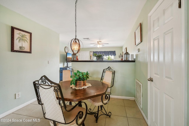 dining area with ceiling fan and light tile patterned floors