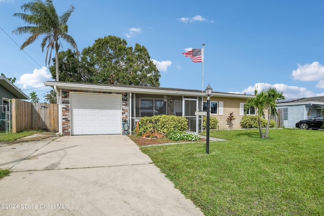 single story home featuring a front yard and a garage