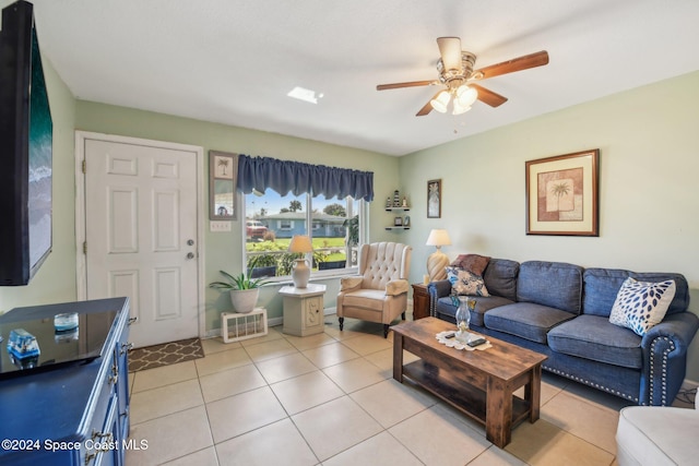 tiled living room with ceiling fan