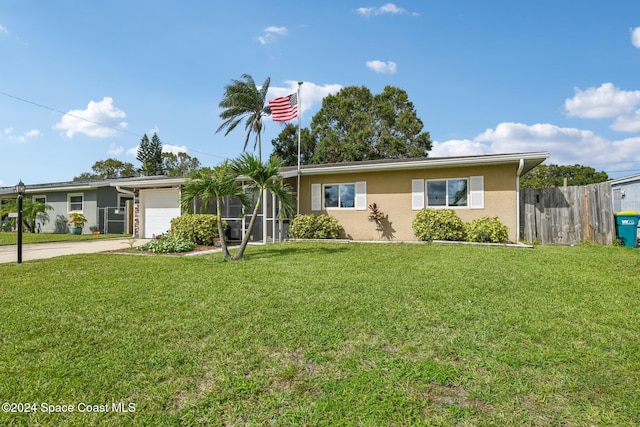 ranch-style home with a garage and a front lawn