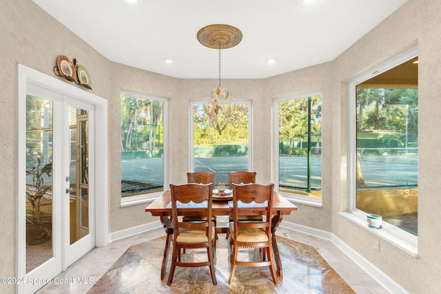 sunroom with an inviting chandelier and plenty of natural light