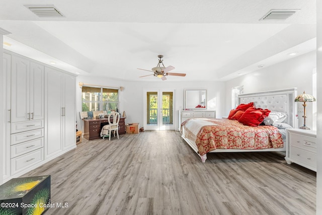 bedroom with light hardwood / wood-style flooring and ceiling fan