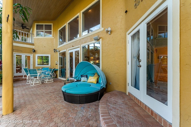 view of patio with french doors and ceiling fan