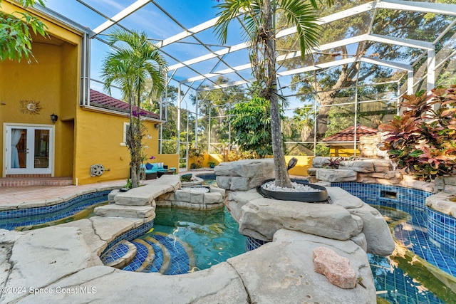 view of pool featuring a patio and glass enclosure