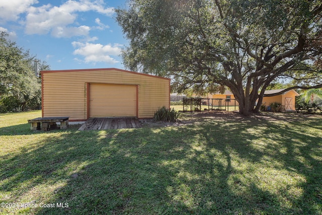 garage featuring a lawn