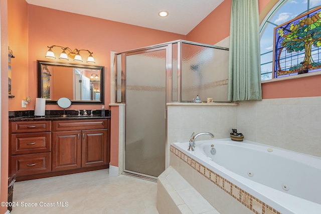 bathroom featuring vanity, shower with separate bathtub, and tile patterned floors