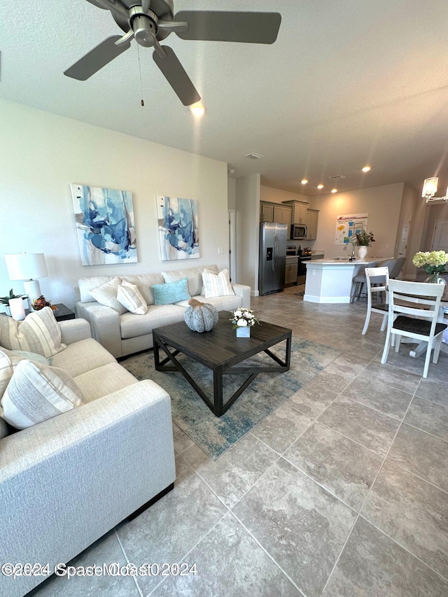 tiled living room featuring ceiling fan