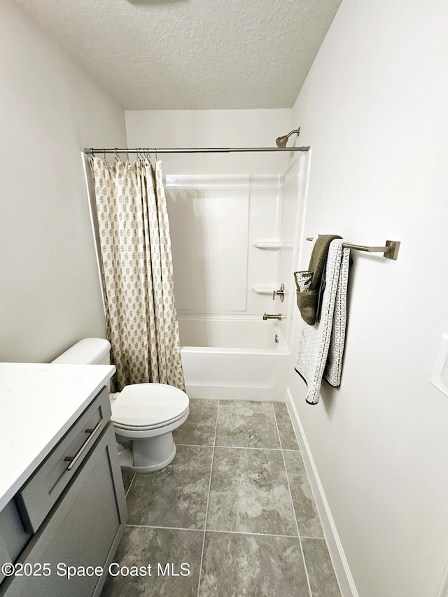 full bathroom featuring shower / bath combo, toilet, a textured ceiling, and vanity