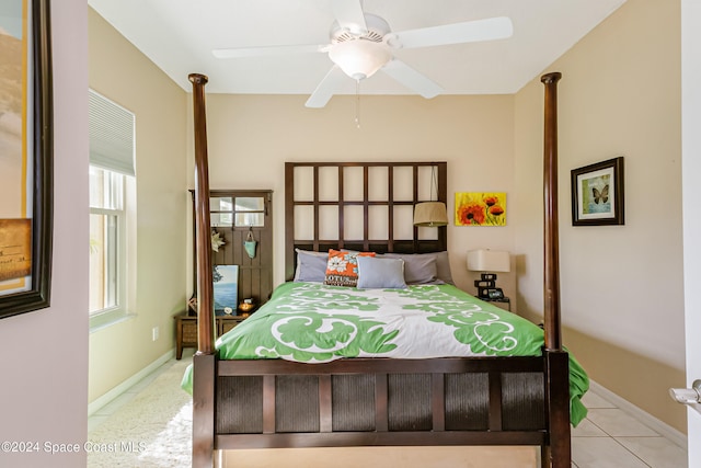 tiled bedroom with ceiling fan