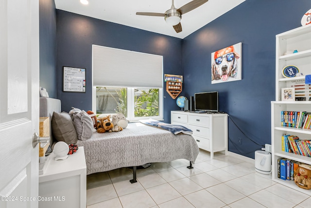 tiled bedroom with ceiling fan