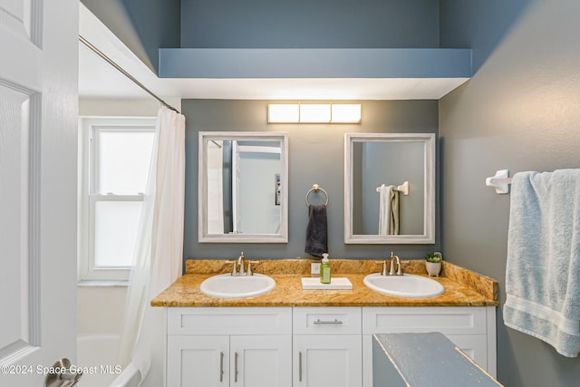 bathroom with vanity and shower / bath combo