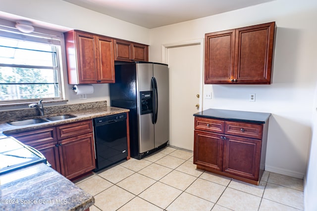 kitchen featuring stainless steel refrigerator with ice dispenser, black dishwasher, sink, and light tile patterned flooring