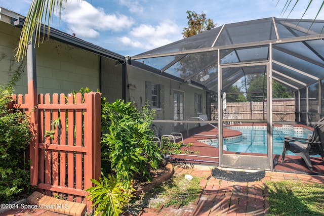 exterior space featuring a fenced in pool, a lanai, and a patio area