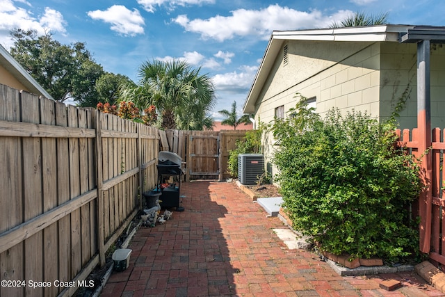 view of patio with central AC unit and grilling area