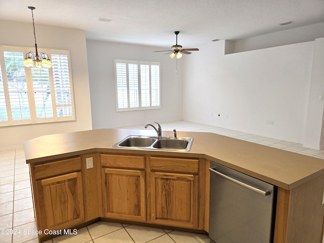 kitchen featuring light tile patterned flooring, dishwasher, sink, and plenty of natural light