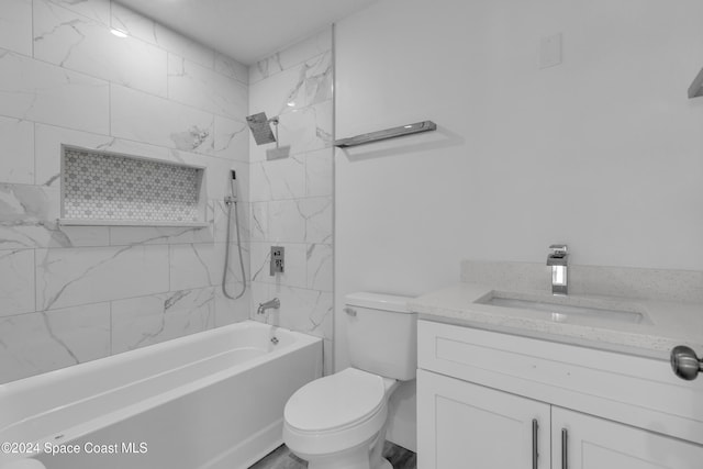 full bathroom with vanity, tiled shower / bath combo, and toilet