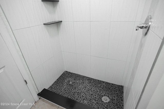 bathroom with tiled shower