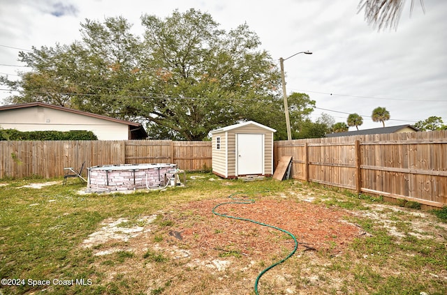 view of yard with a storage shed