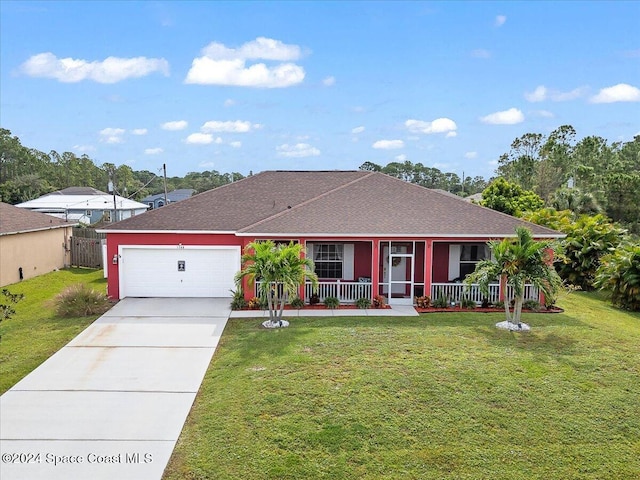 ranch-style home featuring a porch, a front lawn, and a garage