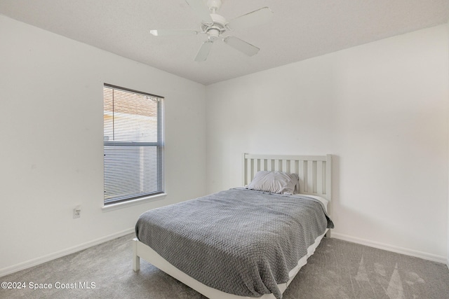 bedroom with ceiling fan and carpet flooring