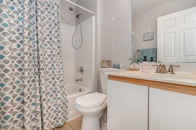 full bathroom featuring vanity, shower / bath combo with shower curtain, toilet, and tile patterned floors