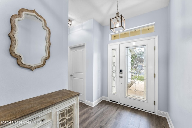 foyer with dark hardwood / wood-style floors