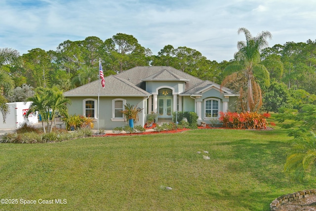 ranch-style house with a front lawn