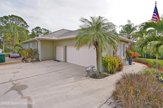 view of side of home with a garage