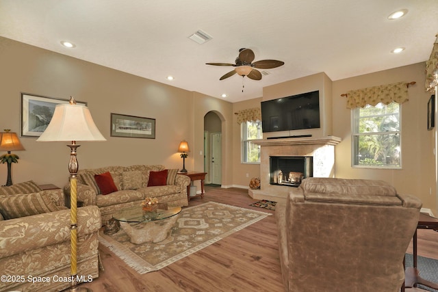 living room featuring ceiling fan and wood-type flooring