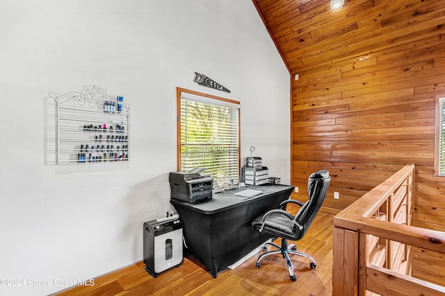 office space featuring hardwood / wood-style floors, high vaulted ceiling, wooden ceiling, and wood walls