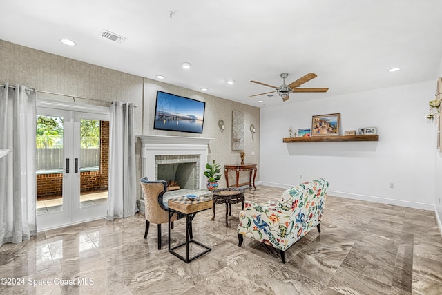 living room featuring french doors and ceiling fan