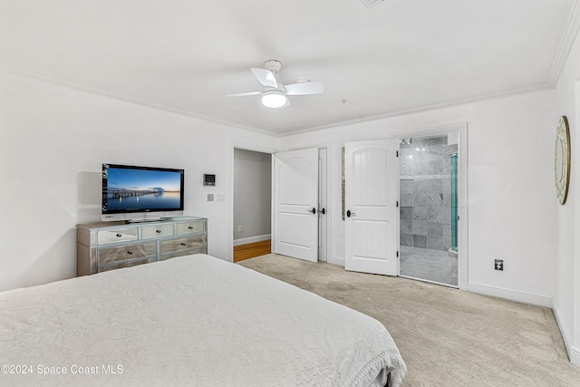 bedroom with ensuite bath, light carpet, crown molding, and ceiling fan